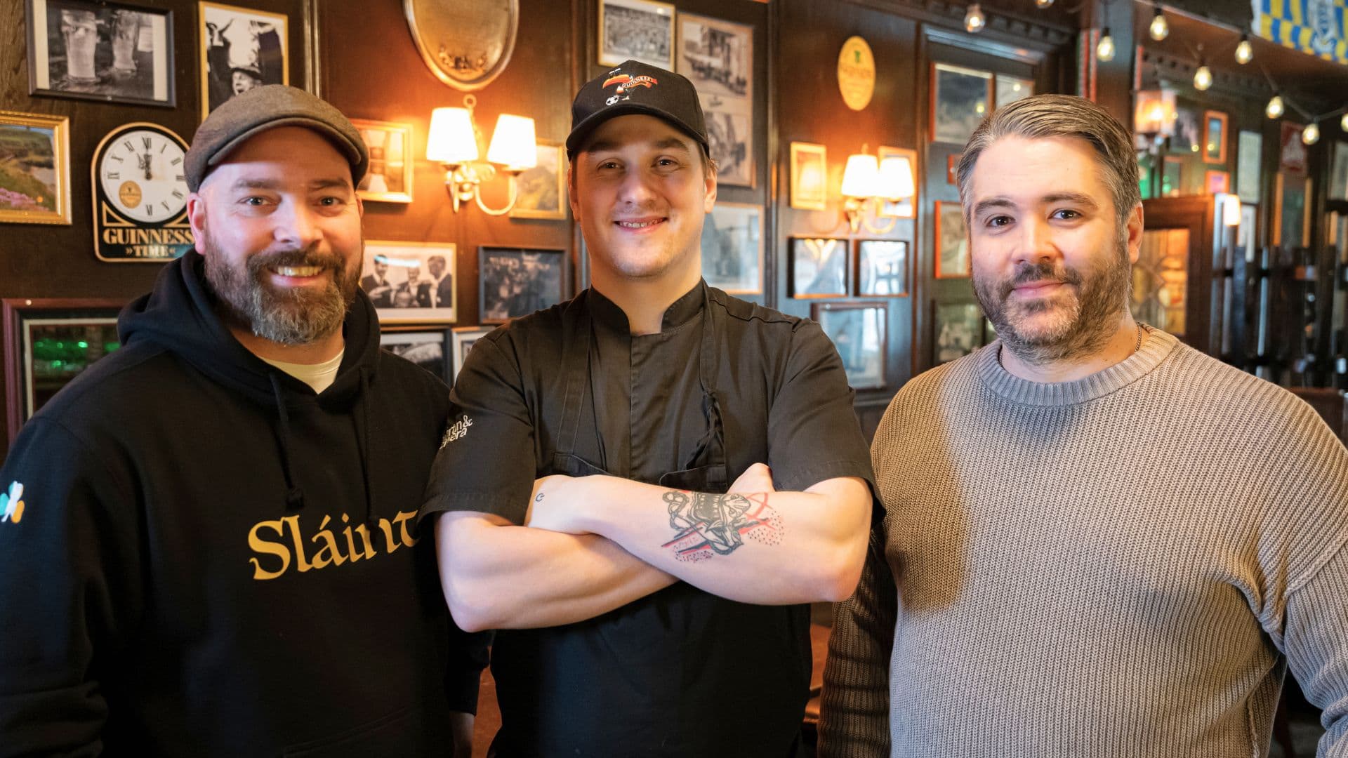 Victor stands with colleagues at Slàinte restaurant in Växjö, Sweden. Following personalised support from Clustera and completion of vocational training, Victor built a successful career and became head chef.
