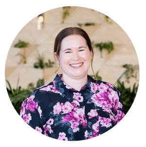 Woman in floral business shirt smiling