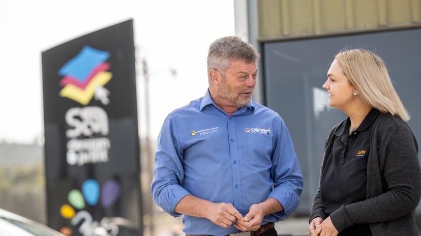APM EC Amelia talks to a DES employer outside a business
