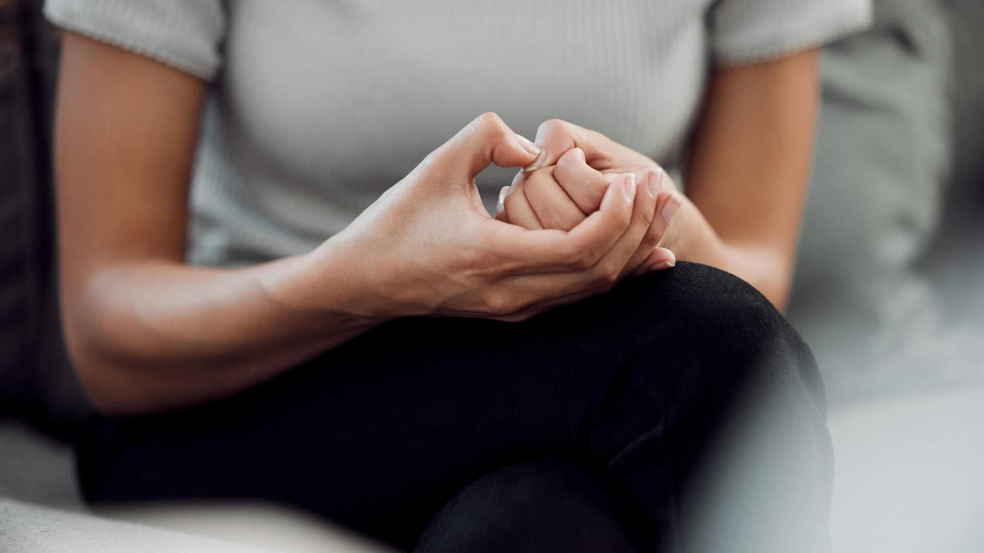 A close up of a woman's fidgeting hands