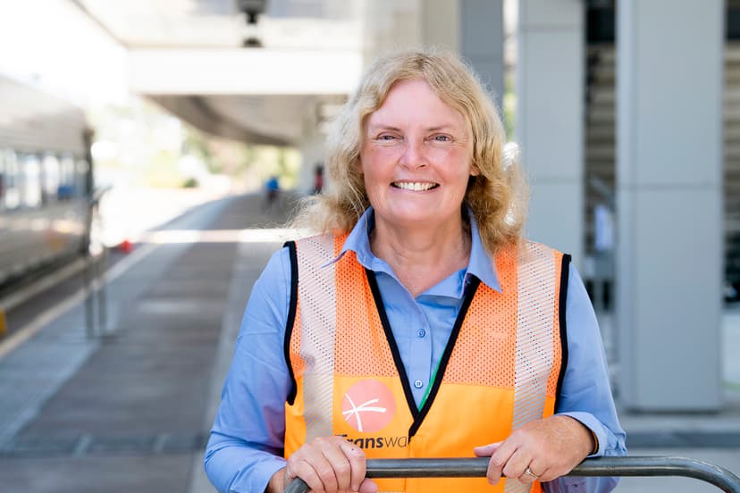 Inclusive Employment Australia participant Sharon smiles on a train station platform