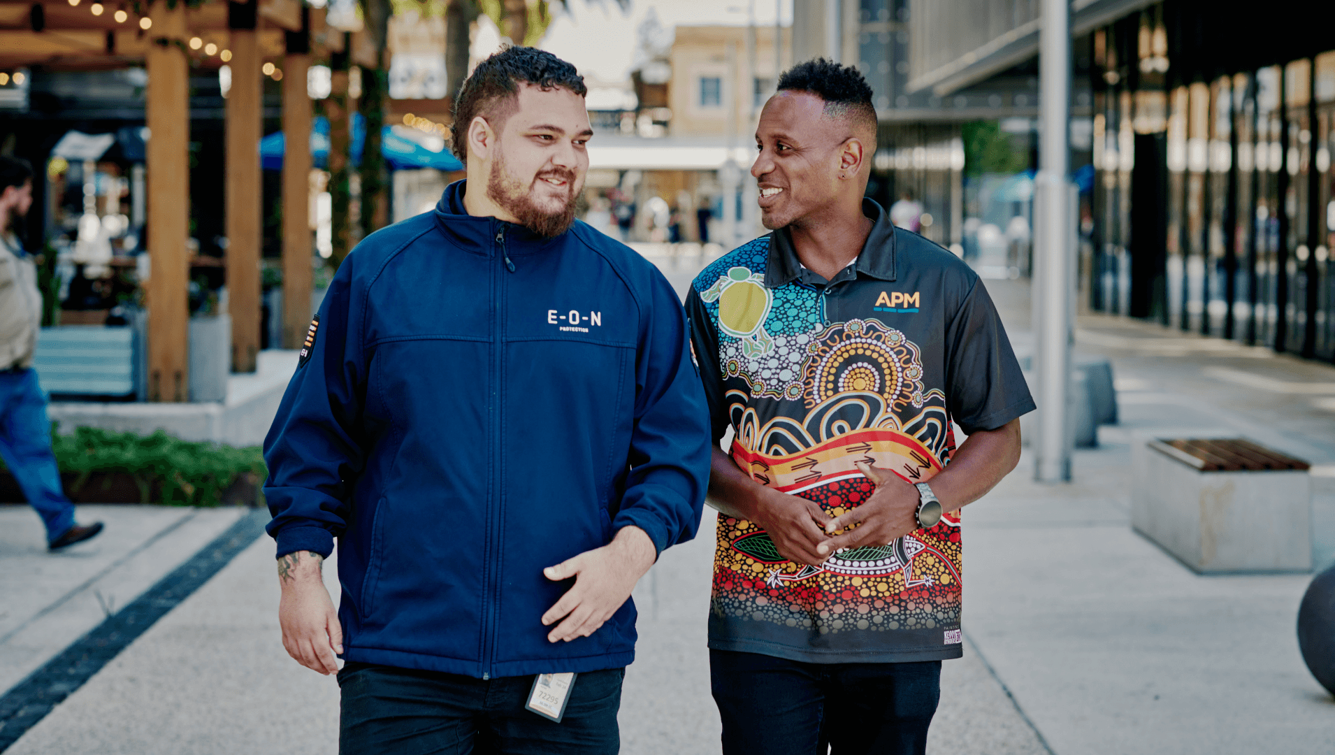 Workforce Australia participant and APM employee in a First Nations polo walk and talk togetger