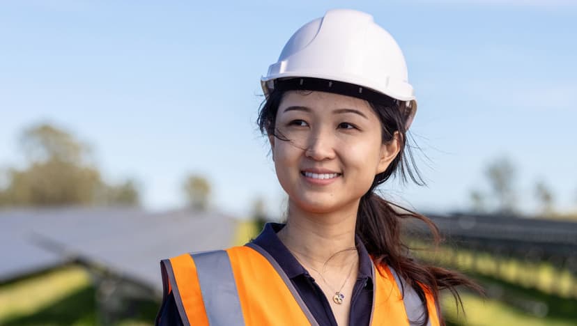A female apprentice in safety gear symbolising APM Apprentices focus on female and energy renewable roles.