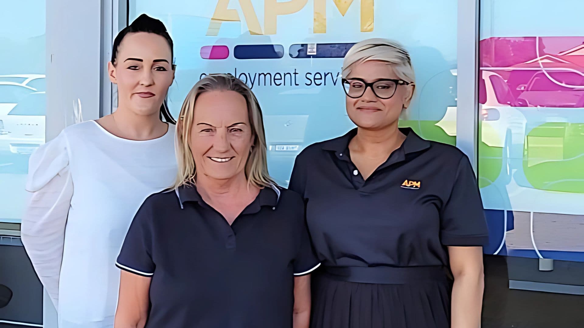 DES participant Debra Murphy and APM team members outside an APM branch.