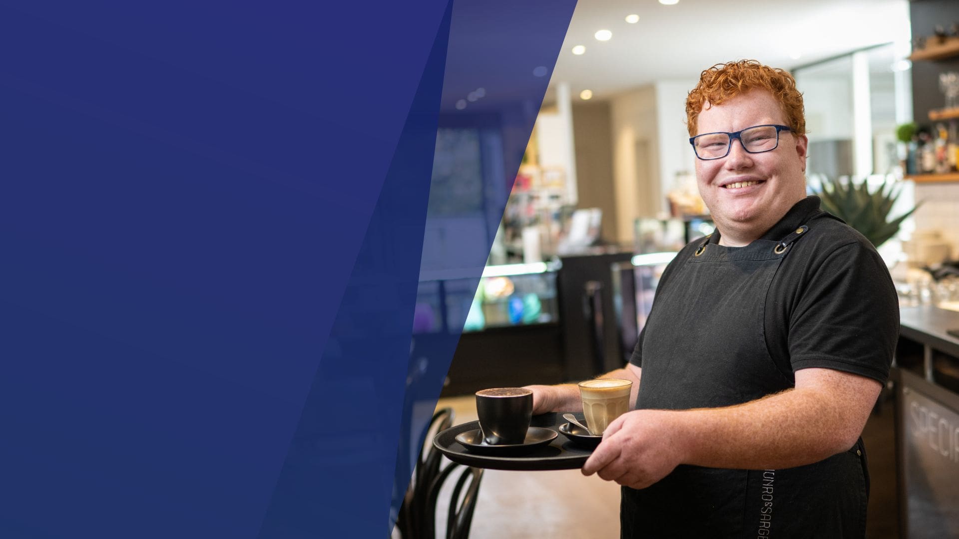 Job seeker with disability working in a cafe and smiling