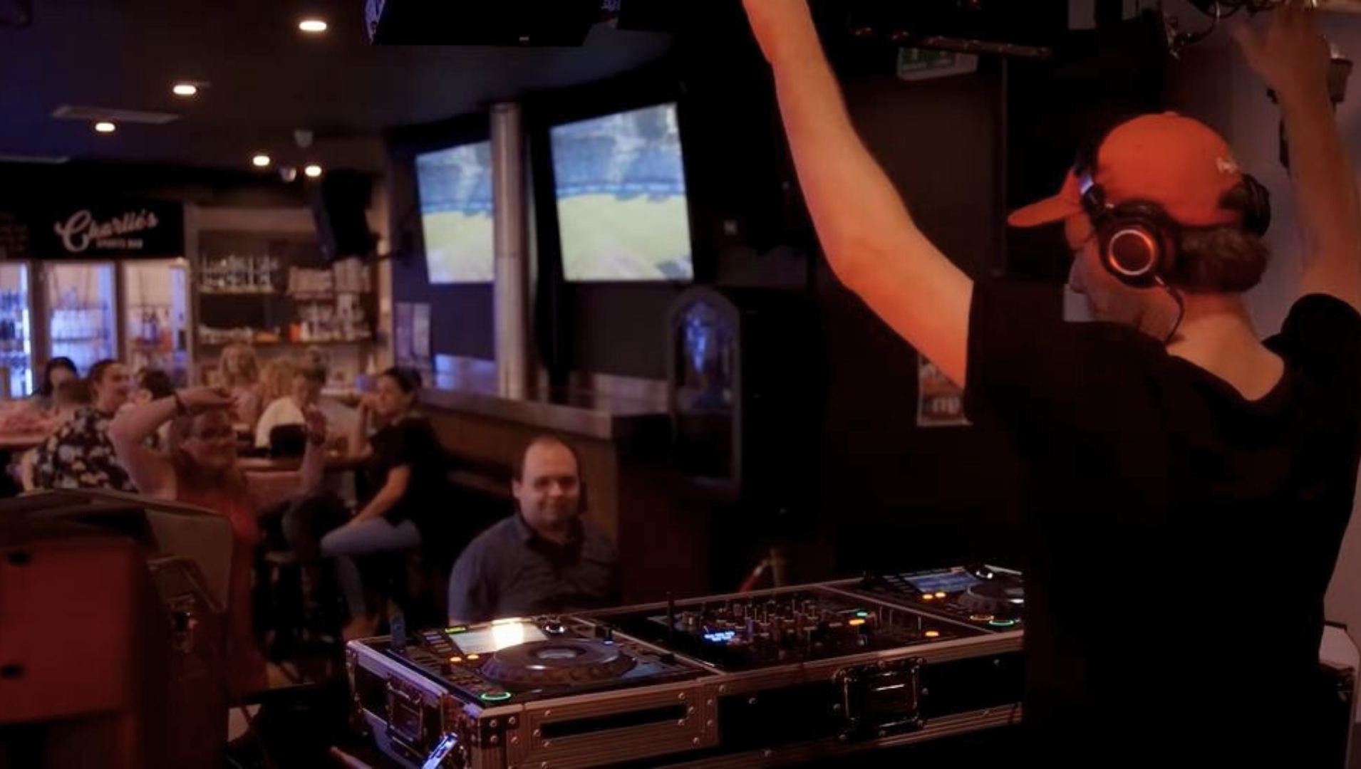 A DJ pumps up the crowd at the disability inclusive EasyBeatz disco