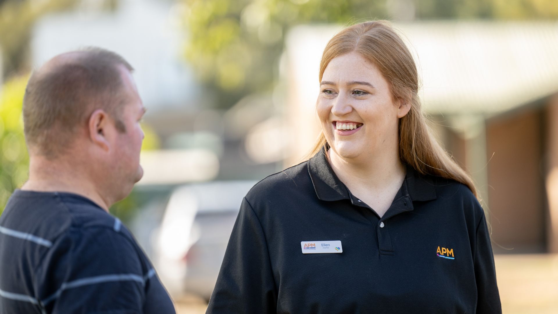 DES consultant and employee talking outside a rural property