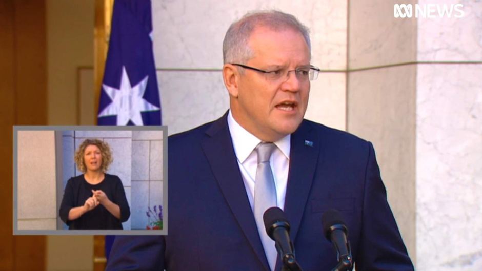 Prime Minister Scott Morrison speaking at a press conference, with an inset of an auslan interpreter
