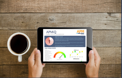 Photo showing two hands holding a tablet device showing the APMiQ program survey