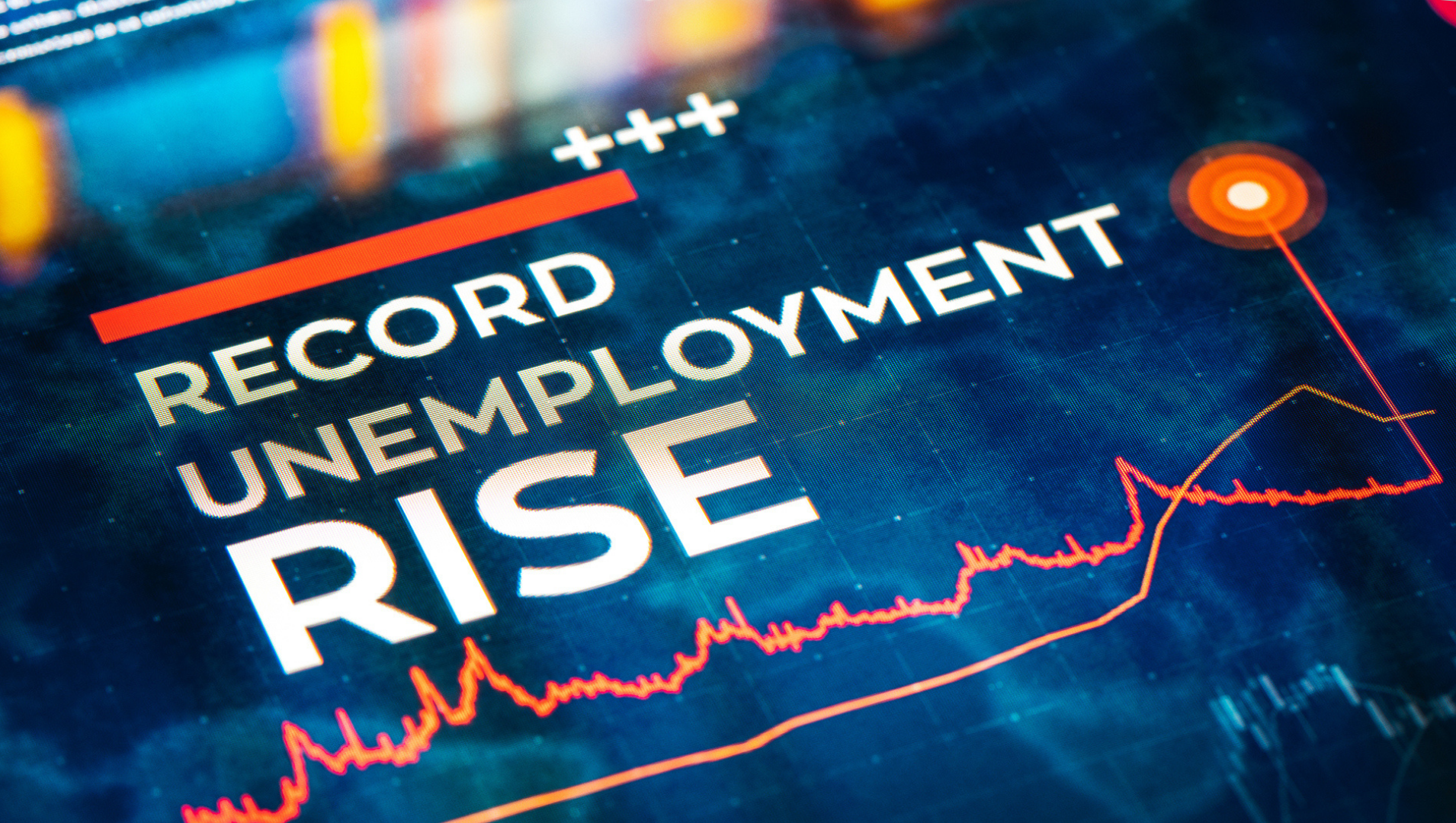 A TV screen depicting the words "record unemployment rise"