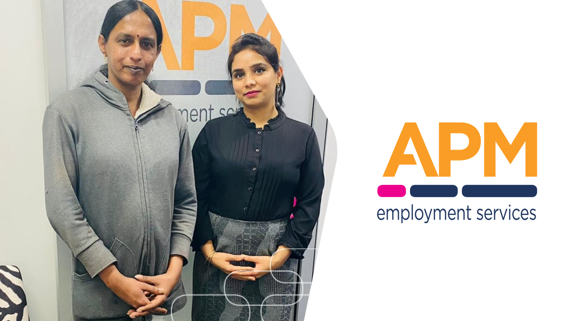 Anita and Harpreet are pictures standing together in front of the APM Burwood office, in front of a door with the APM logo on it