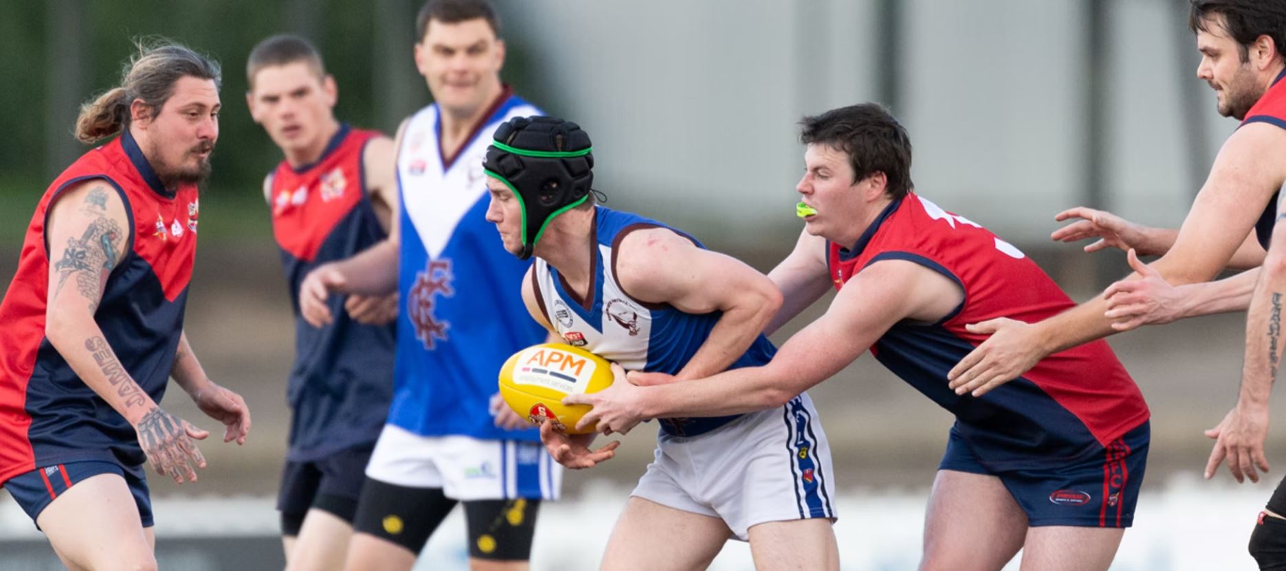 Players clash over the ball in the APM SANFL Inclusive League