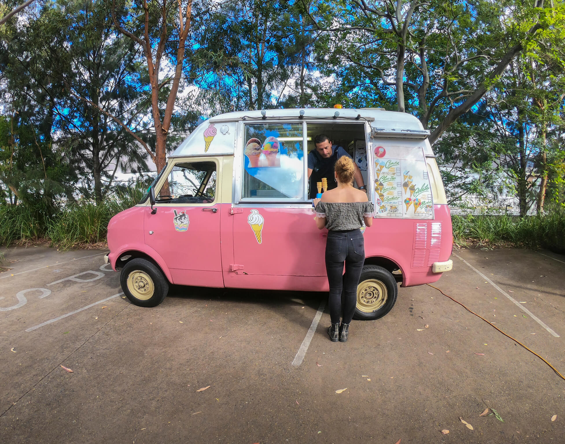 Woman buying an icecream from the icecream truck