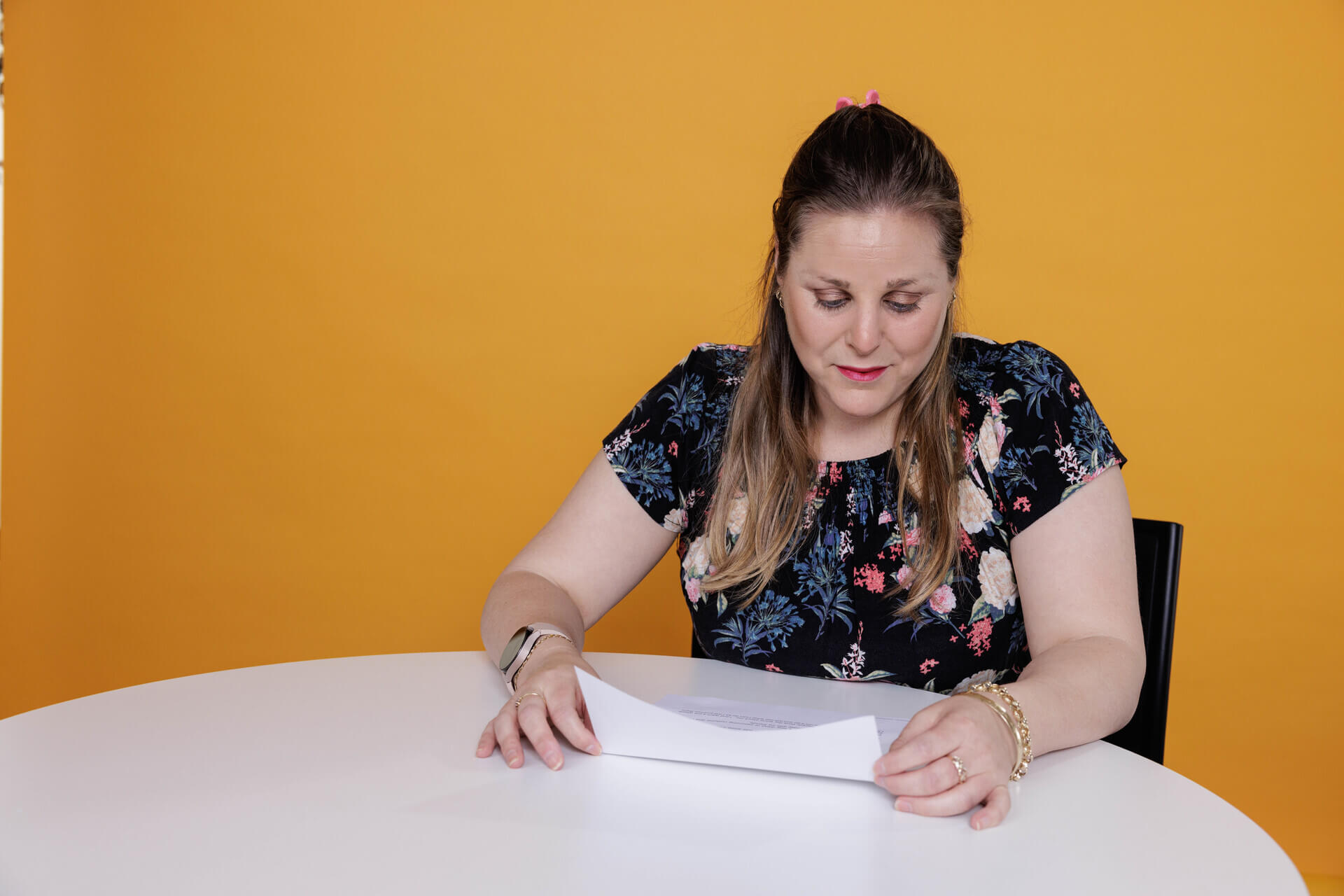 woman looking at paper document