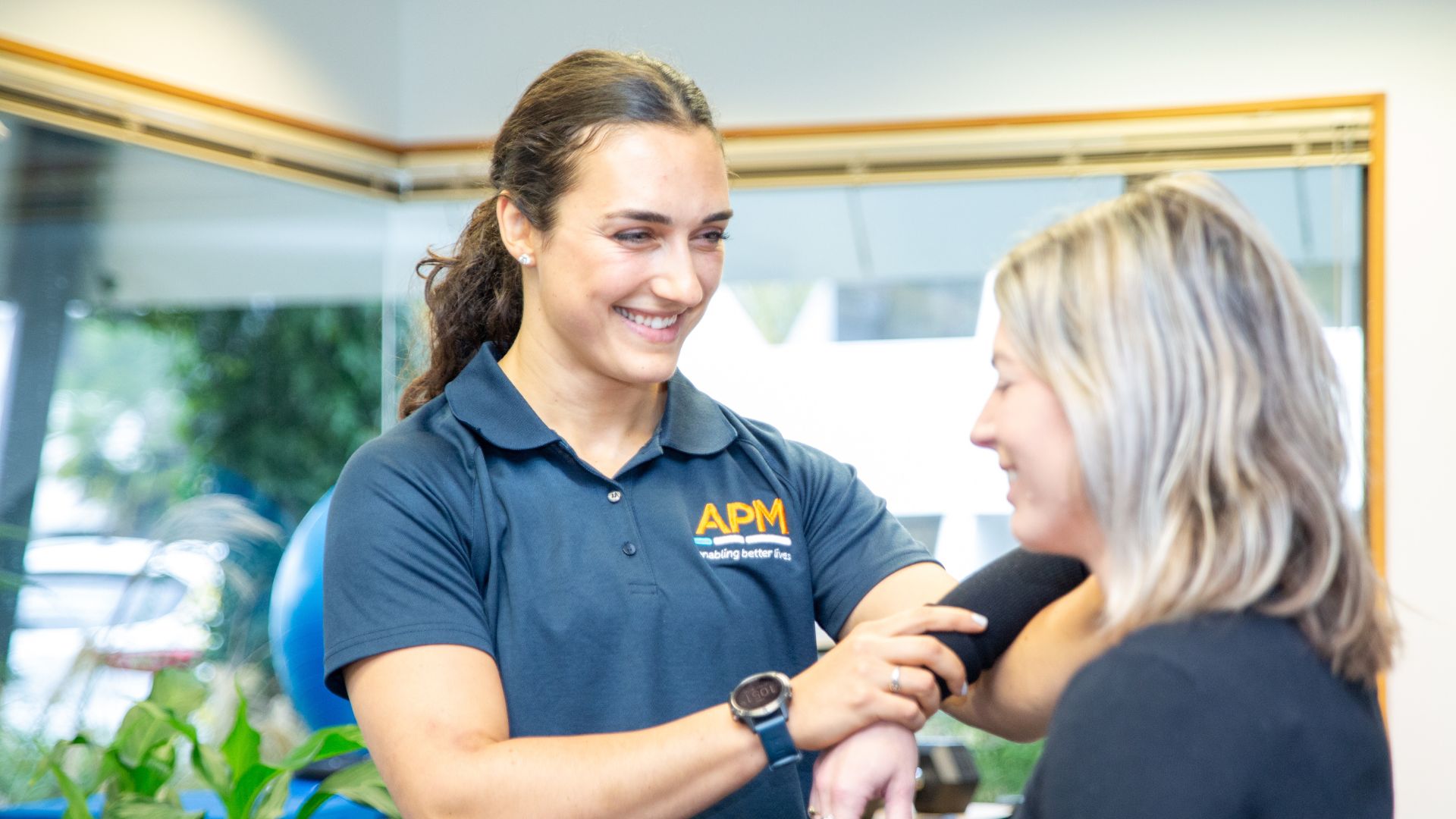 APM Physiotherapist treating a client