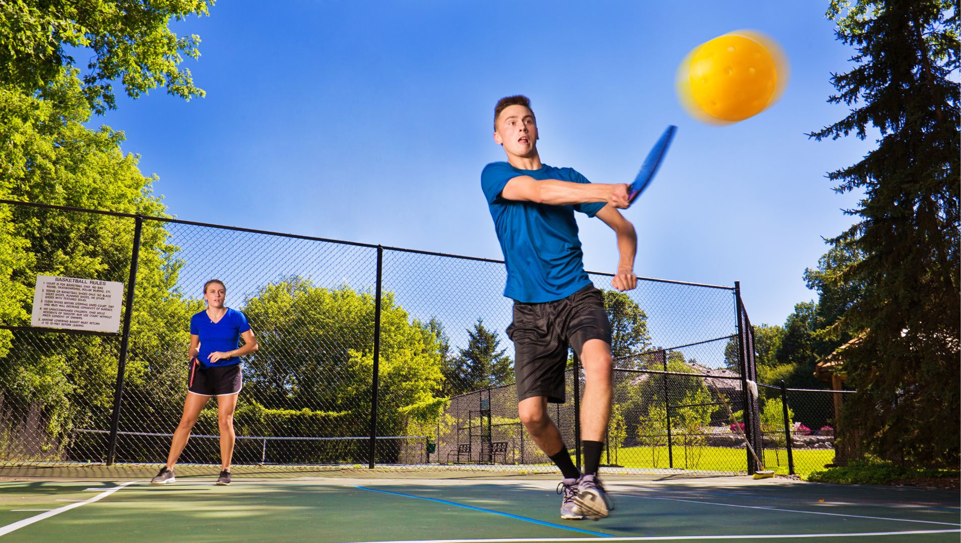A couple play pickleball which is growing in popularity in Australia for its health benefits.