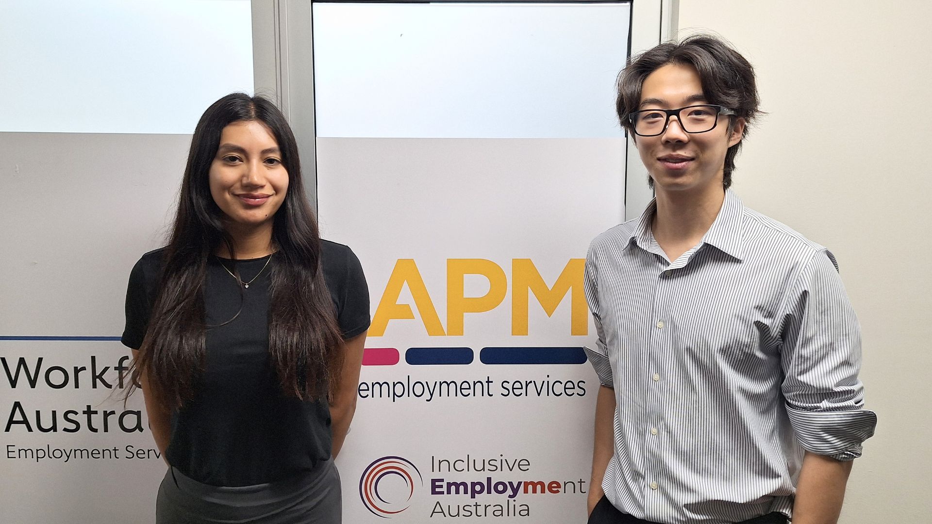 APM Employment Services participant Maria and Employment Consultant Julian standing together in the Sydney office