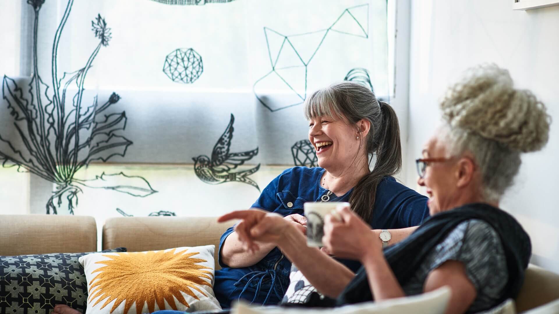 Two women catching up over a cup of tea