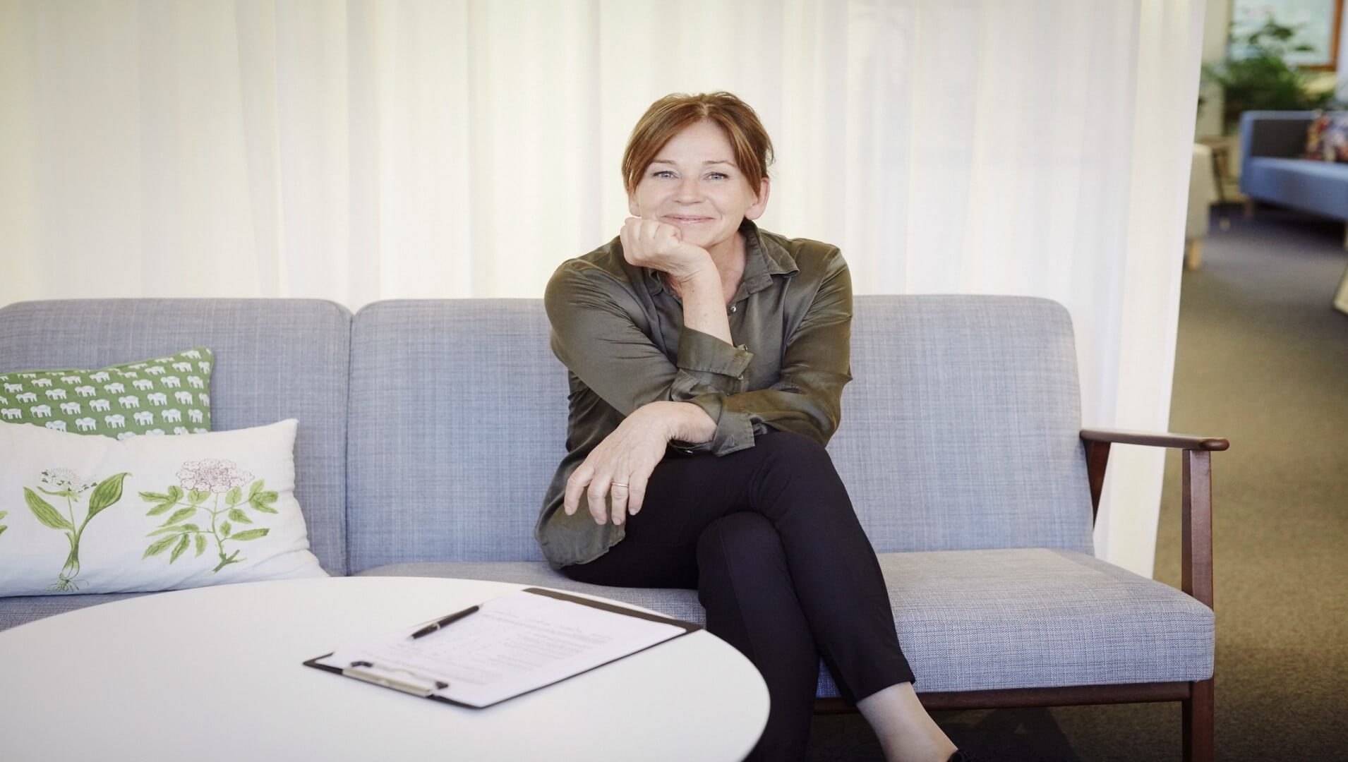 Woman in the workplace with a friendly look on her face