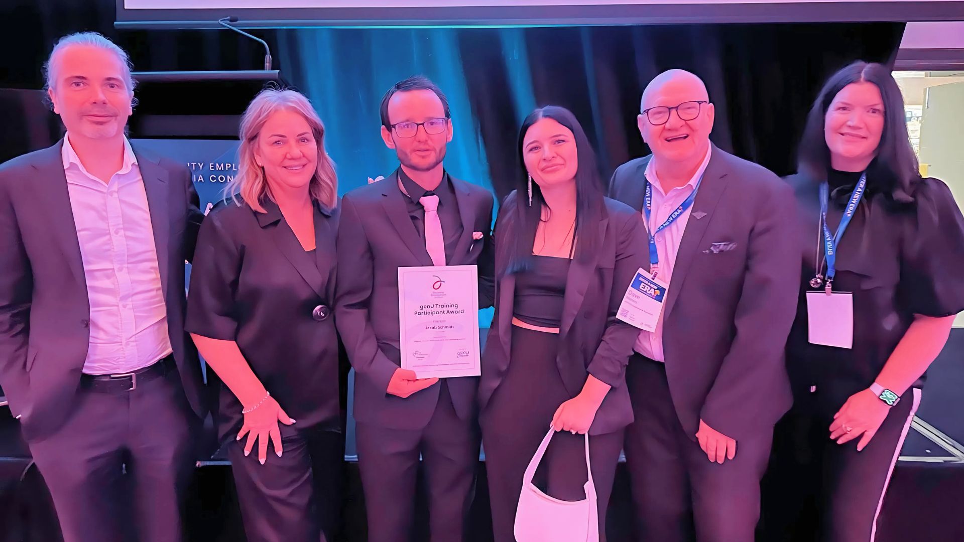 Jacob and his APM team smartly dressed at an awards gala