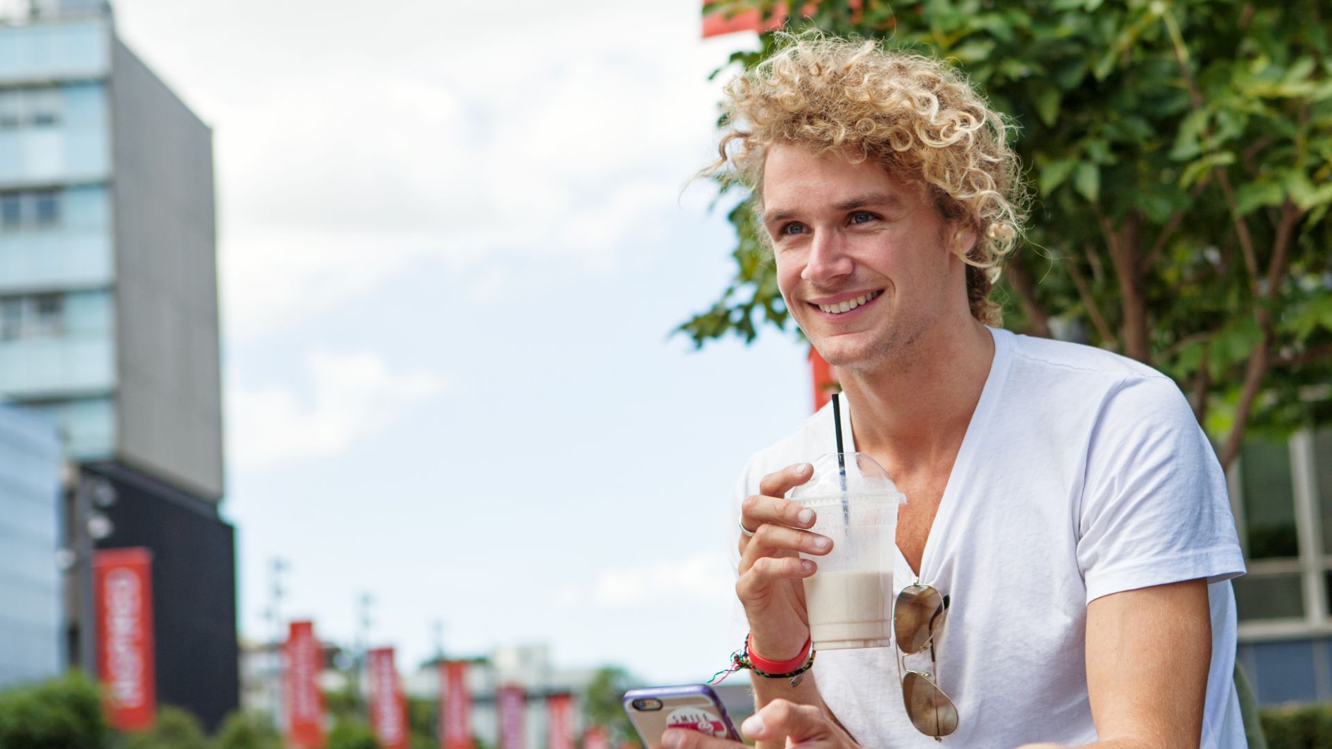 A student working on a laptop in a classroom setting with peers, highlighting APM Futures Tailored Support program.