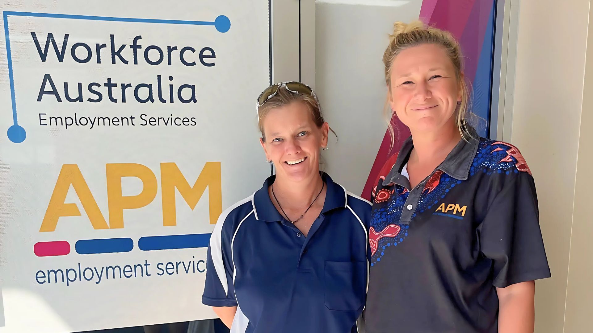 Karina and Morgan outside an APM office