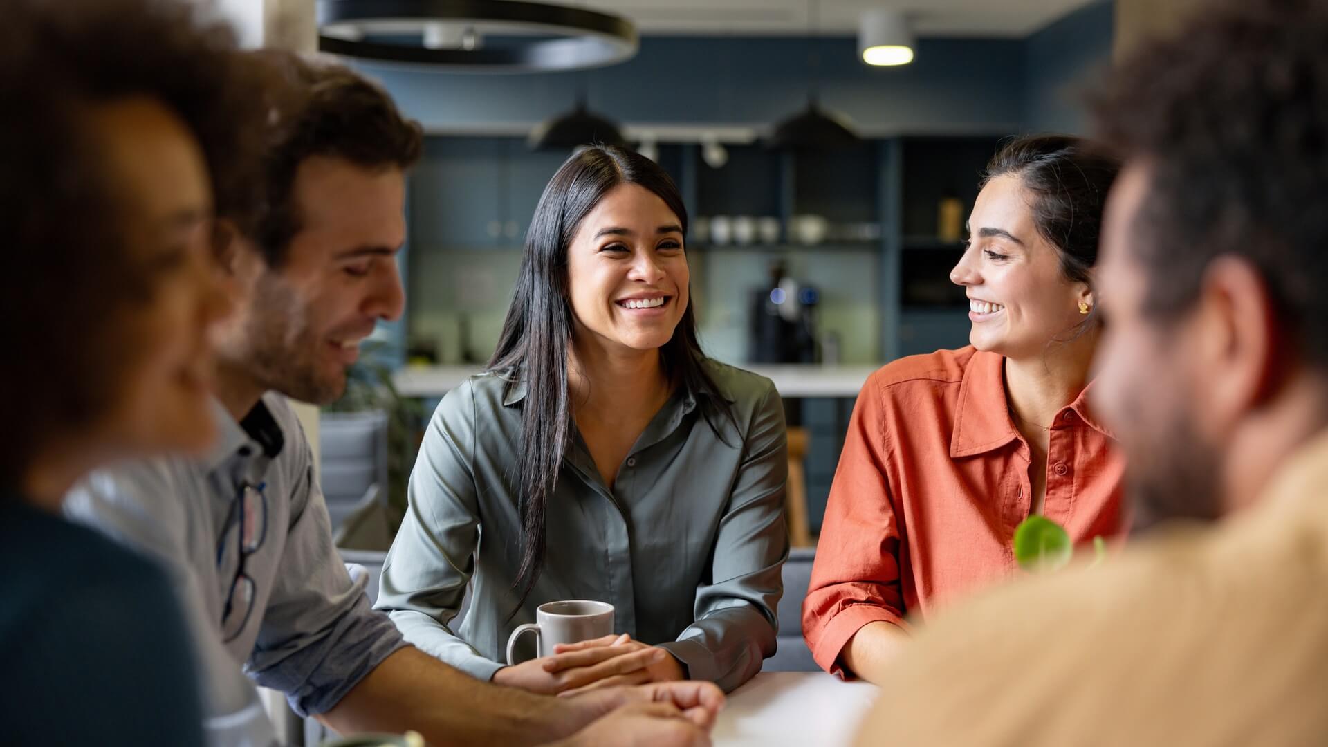 Co-workers having coffee in the break room
