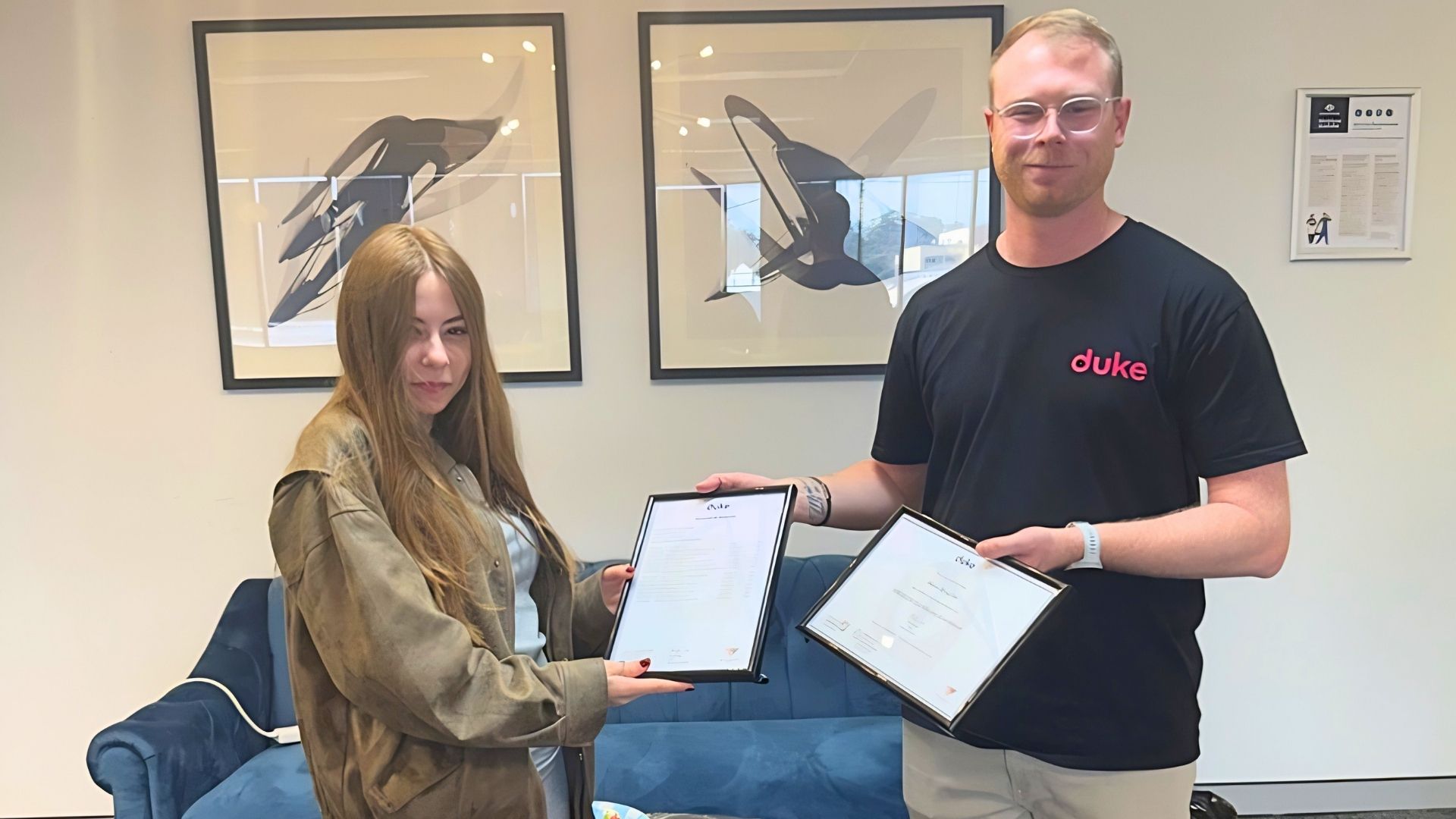 Alice celebrates completing her Certificate III in Retail with Cameron from Duke Education