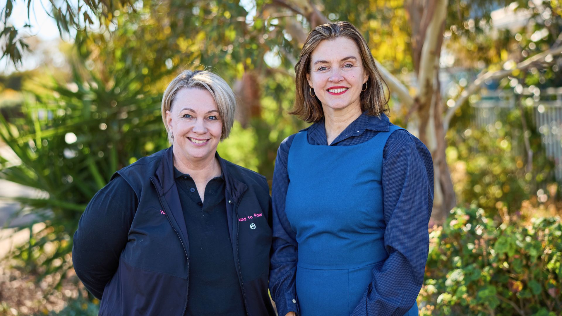 Vicki and Rebecca from APM stand outside