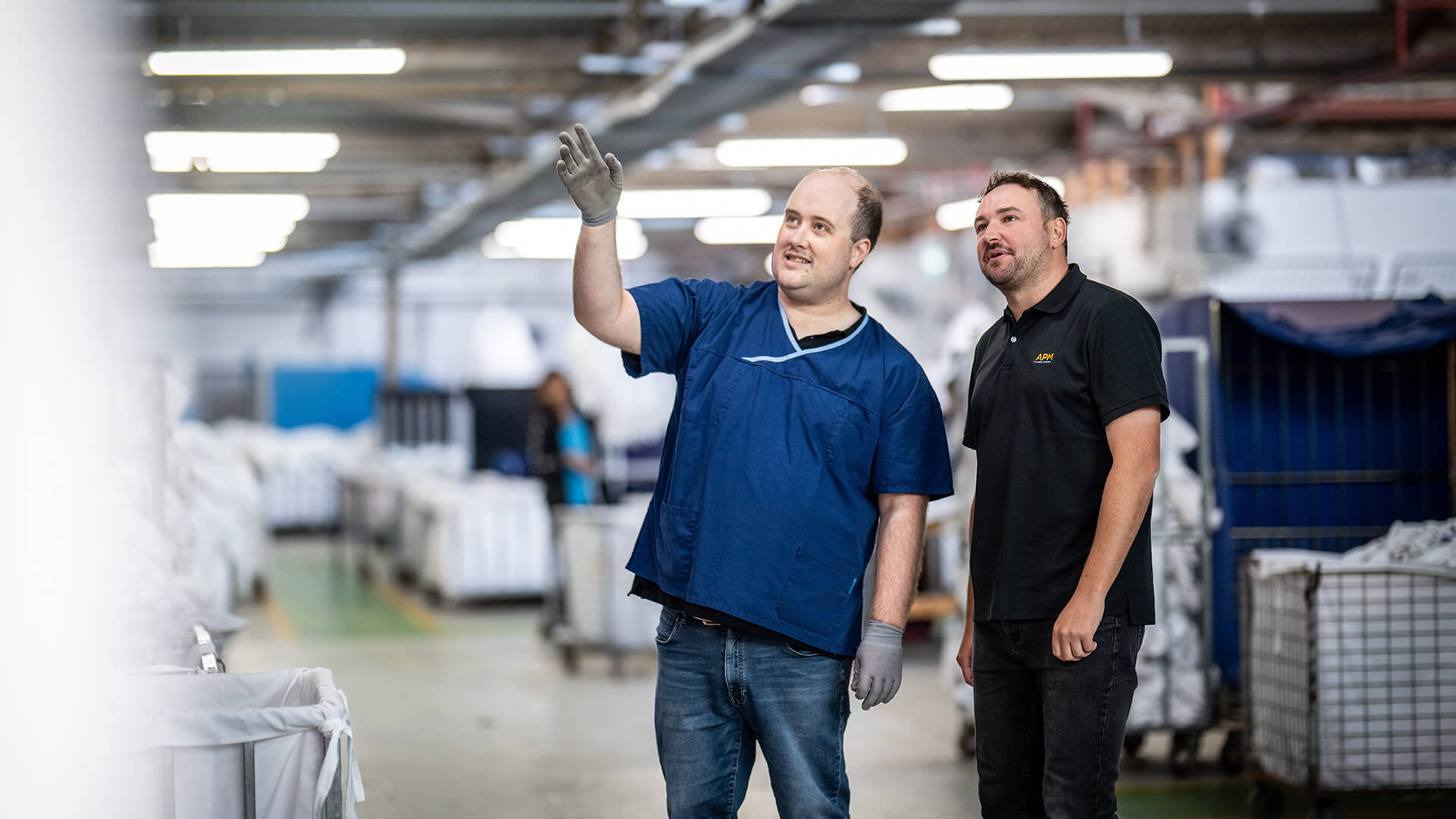 DES participant Stephen with an APM consultant in a warehouse 