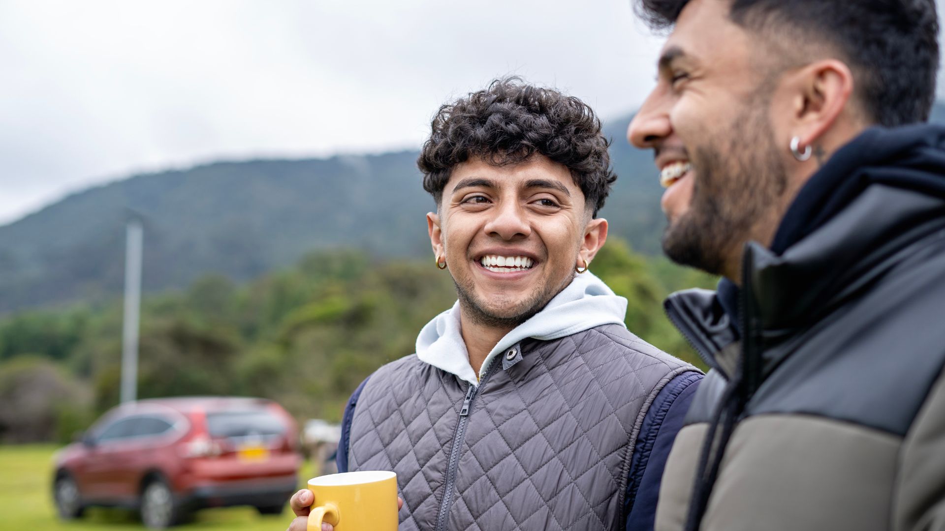 Two people talking outdoors, illustrating the role of social interaction in living with schizophrenia.