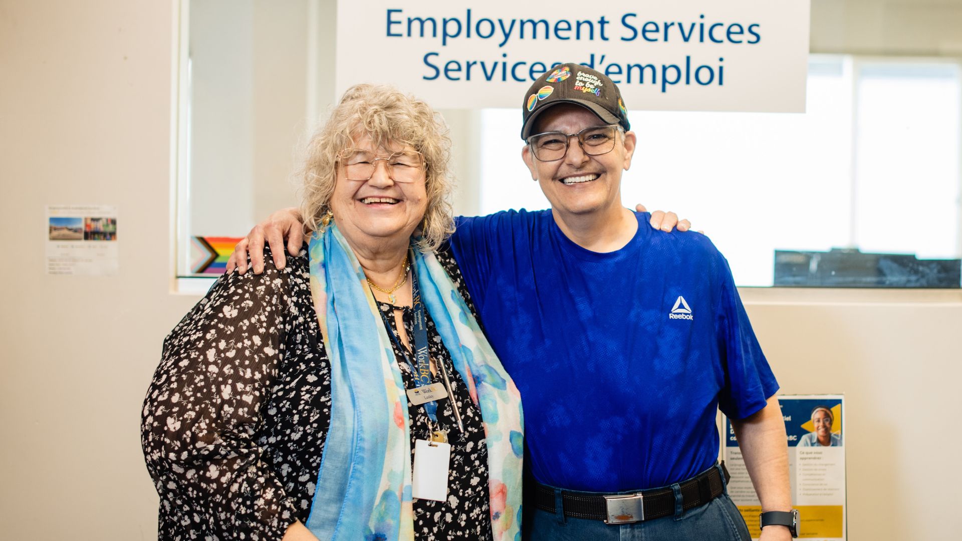 Leigh stands with Lesley, a Customised Employment Consultant at WorkBC. Personalised support helped Leigh overcome barriers to employment and achieve greater independence and wellbeing.