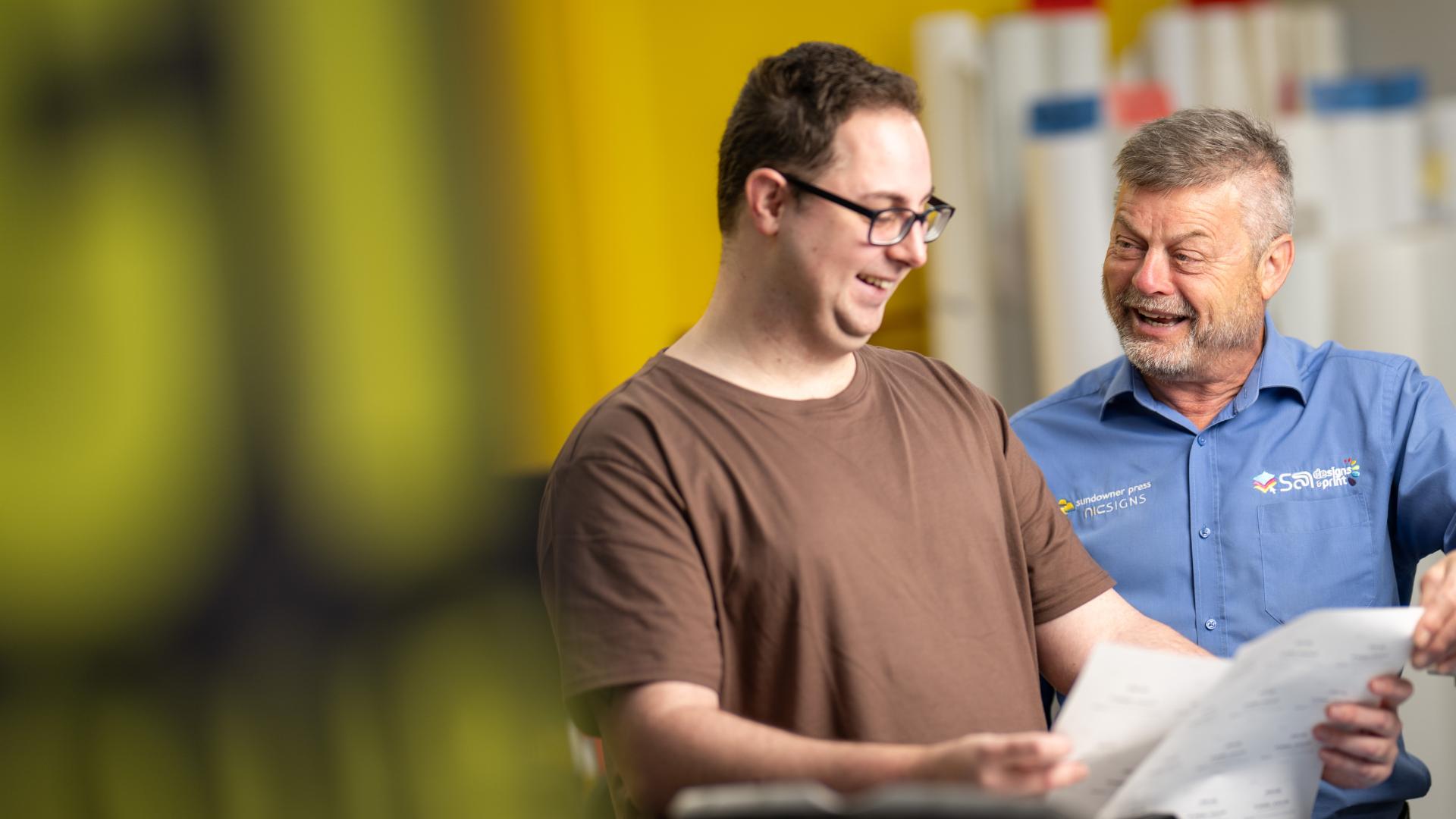 Stephen and his employer in a warehouse