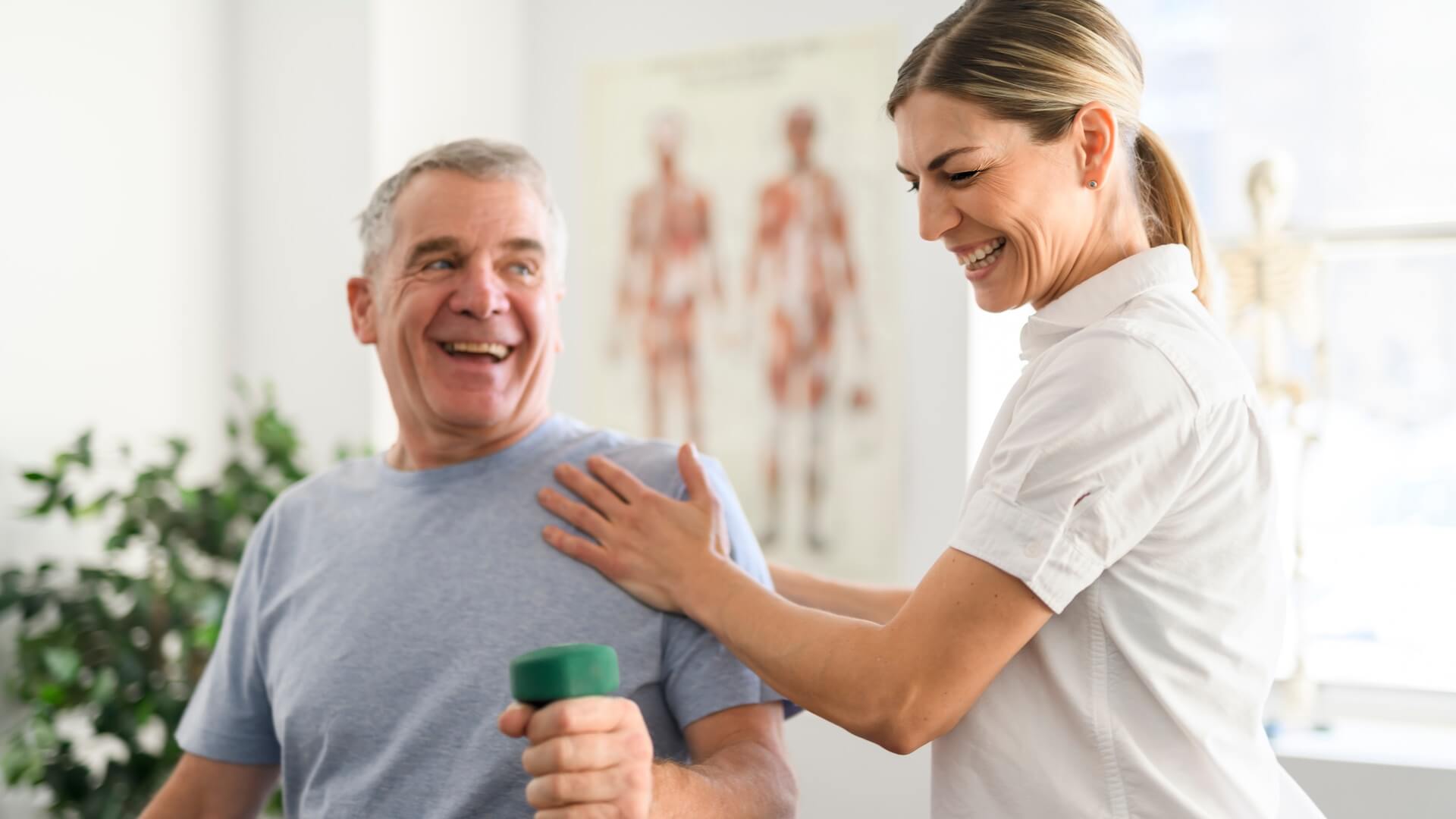 A man doing exercises with a physiotherapist