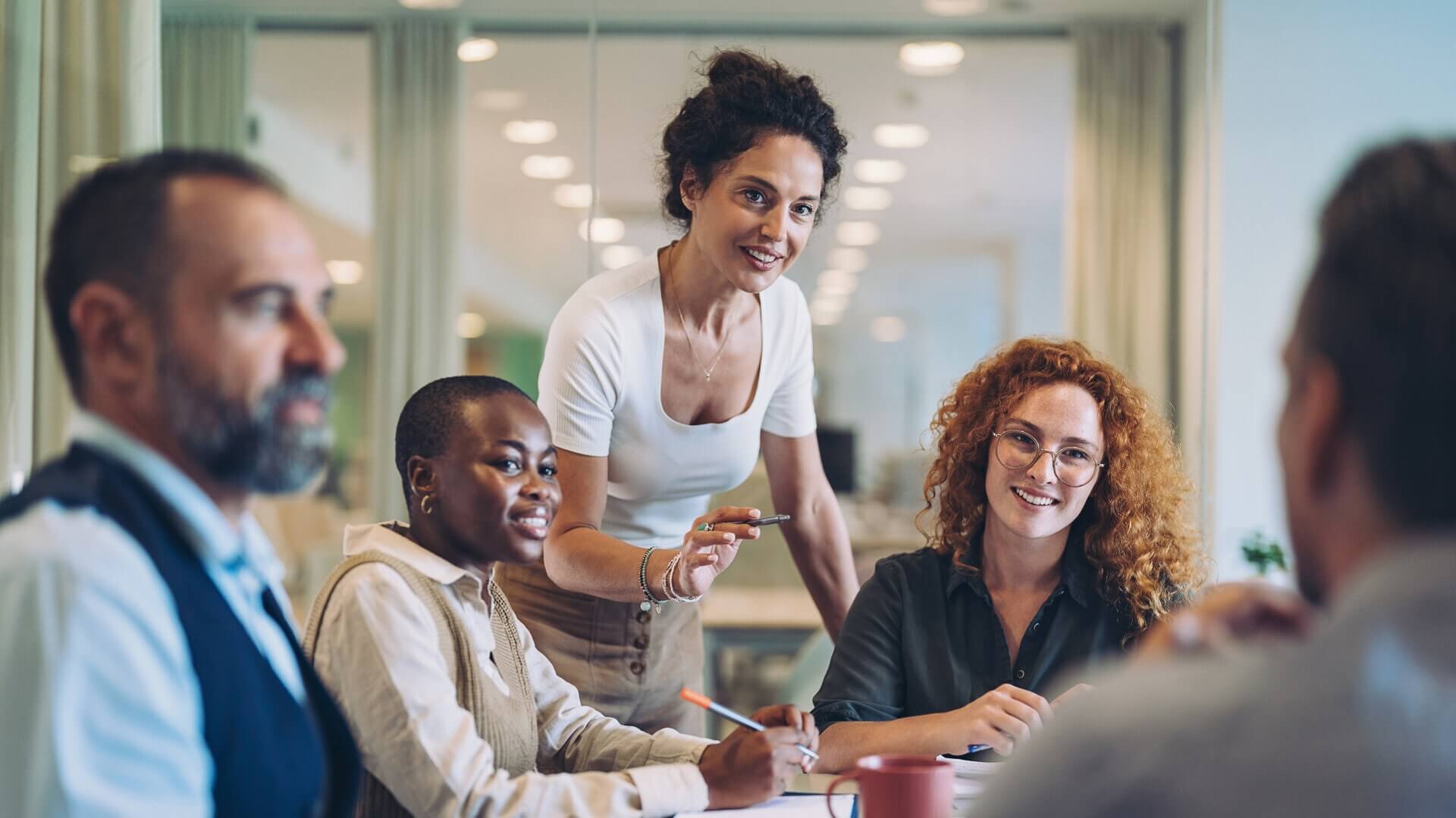 A woman leading her team in a discussion