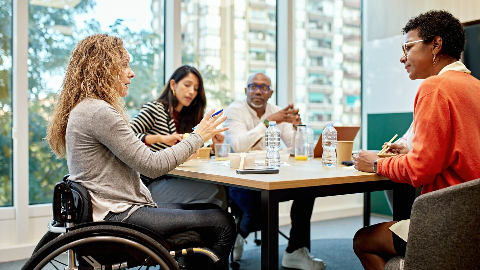 Four diverse co-workers having a meeting
