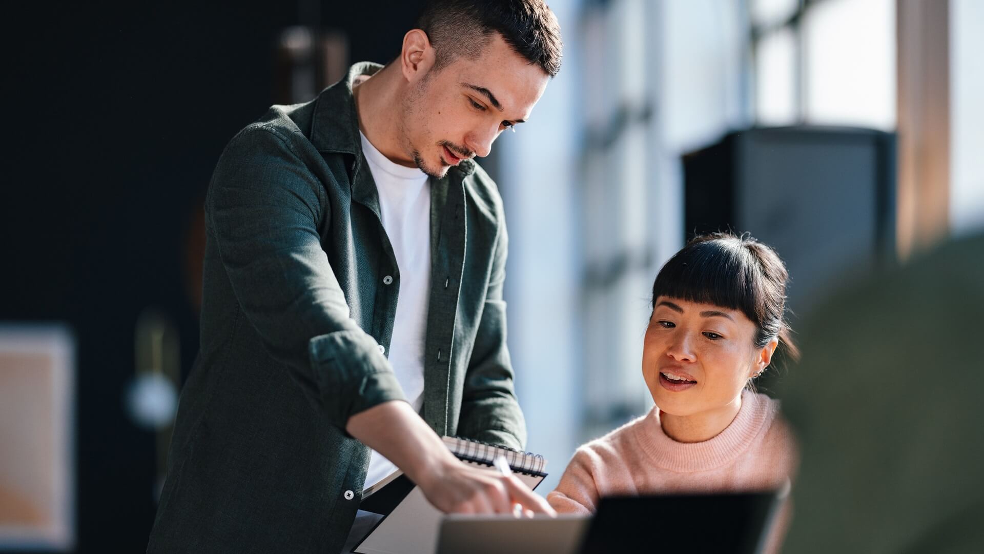 Two colleagues having a discussion about work