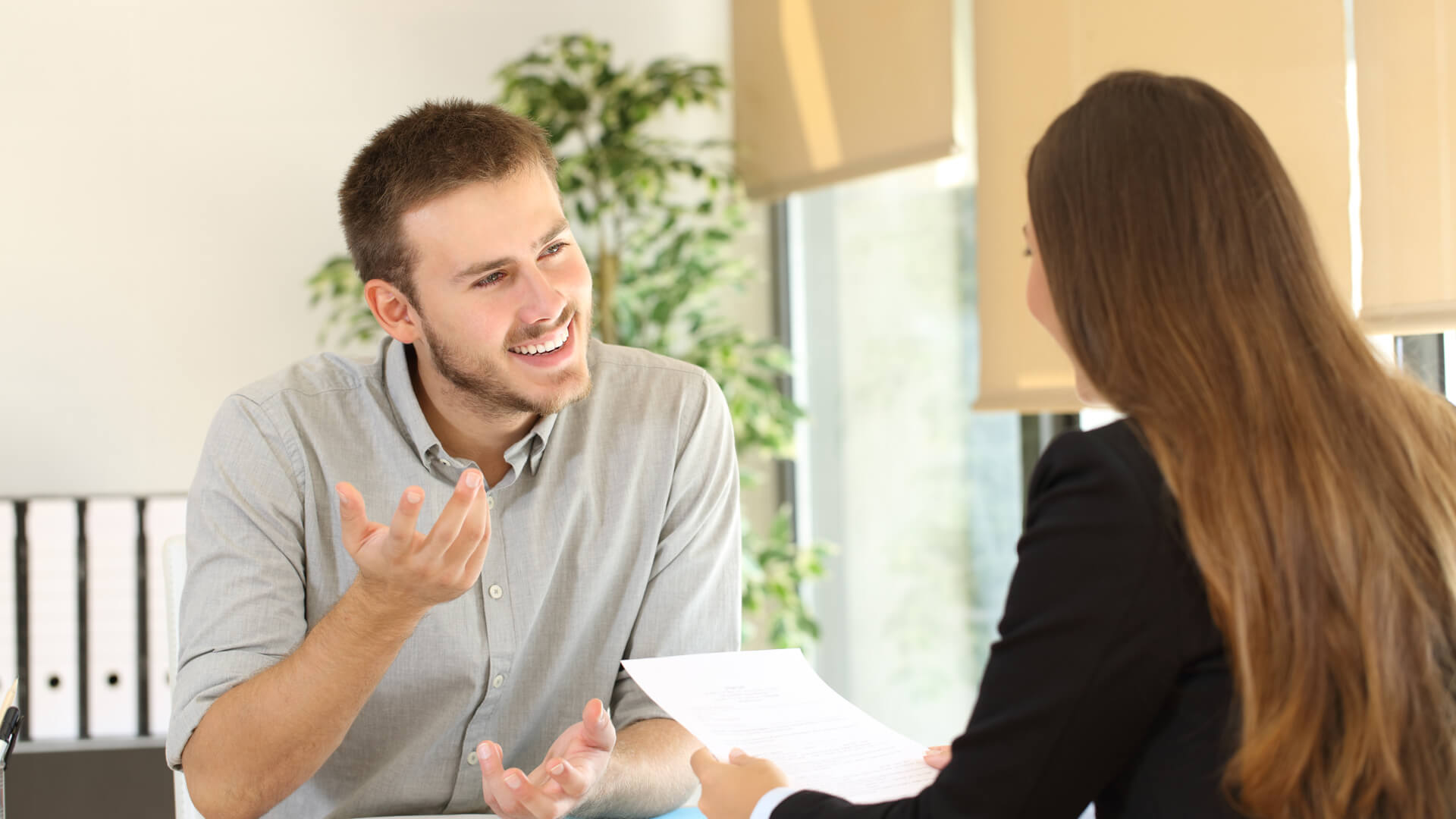 A man smiling during a job interview