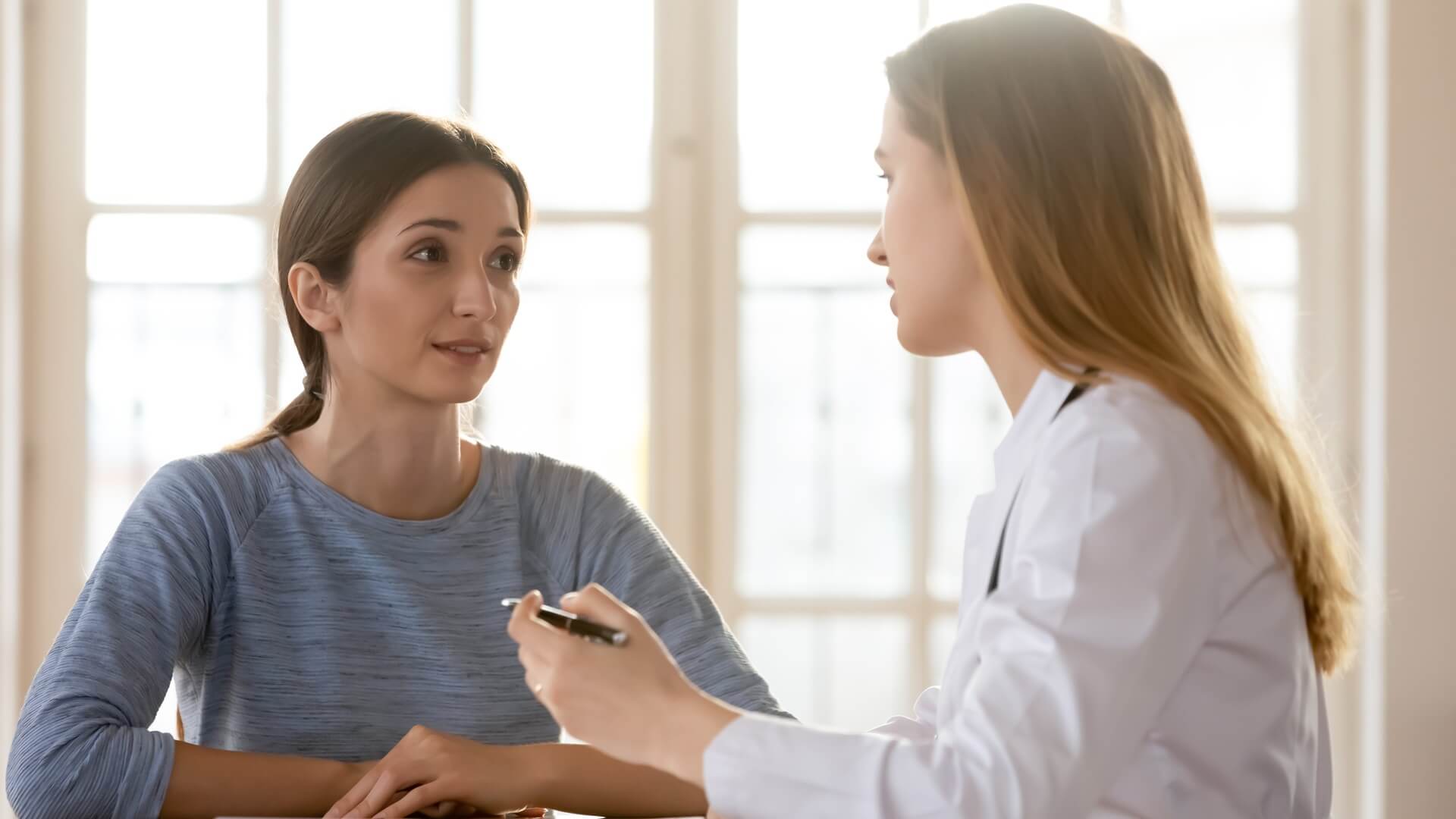 A woman having a consult with her doctor