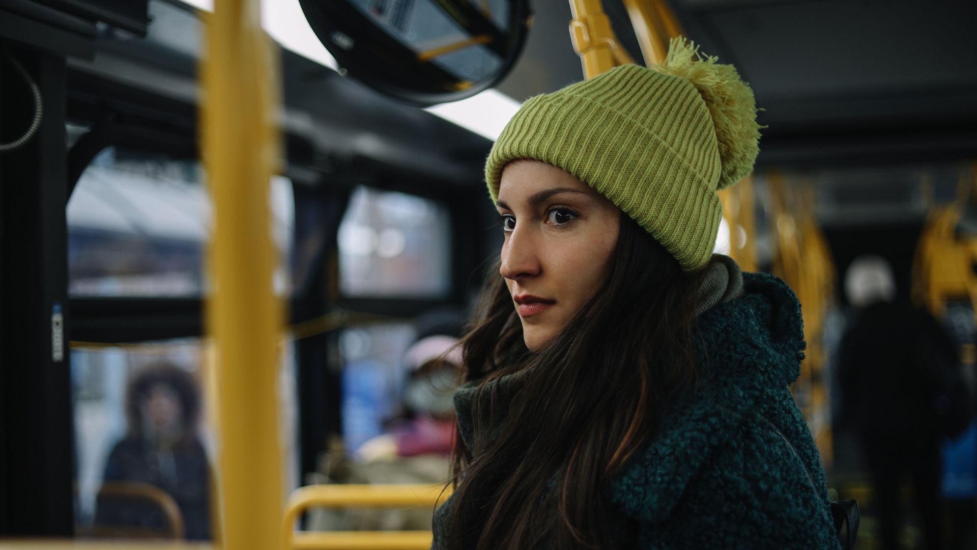 Individual on a bus, illustrating challenges and coping strategies for living with schizophrenia in daily life.