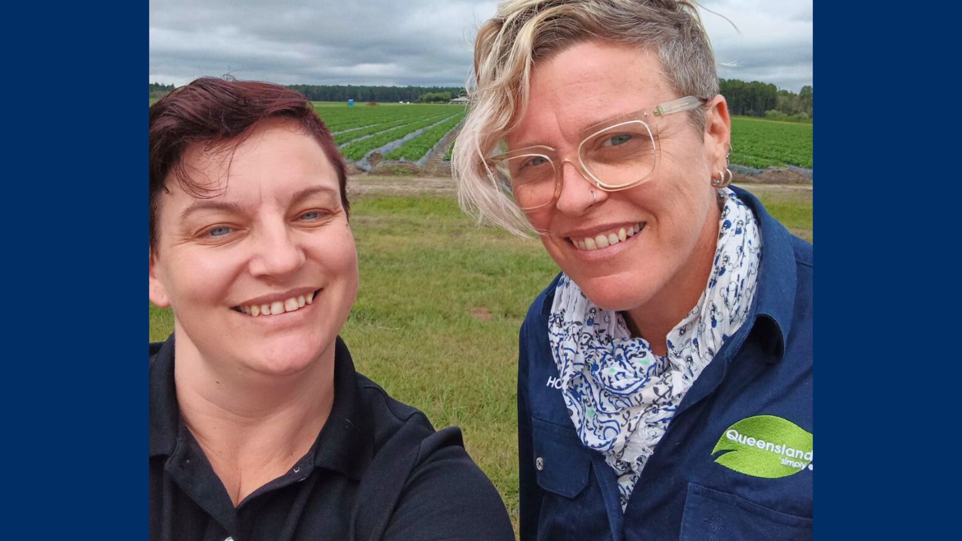Meg and Hope stand outside in a grassy field