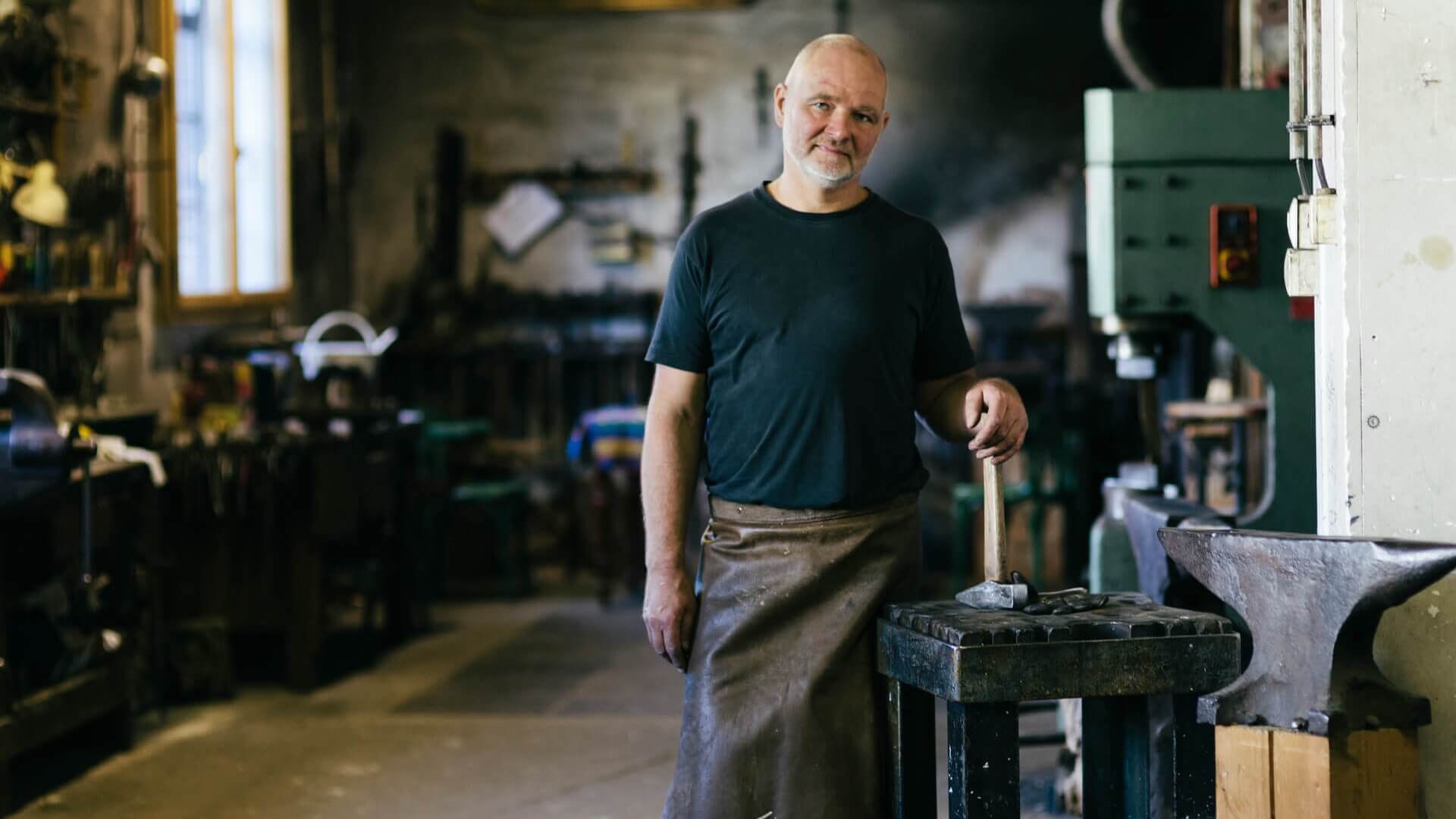 A craftsman standing in his workshop