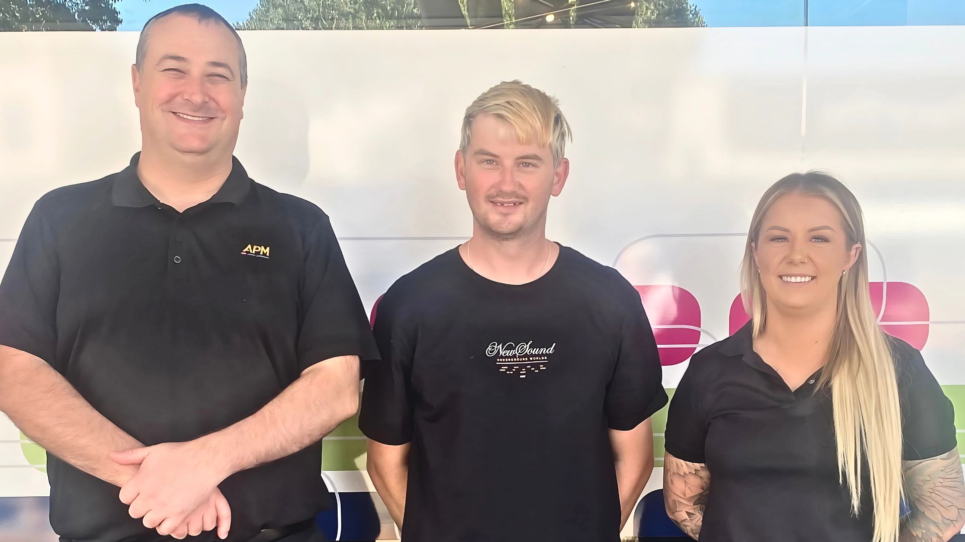 APM Employment Consultant Joel, participant Andrew, and APM Business Manager Courtney standing outside APM Dubbo site after successful job placement through Disability Employment Services