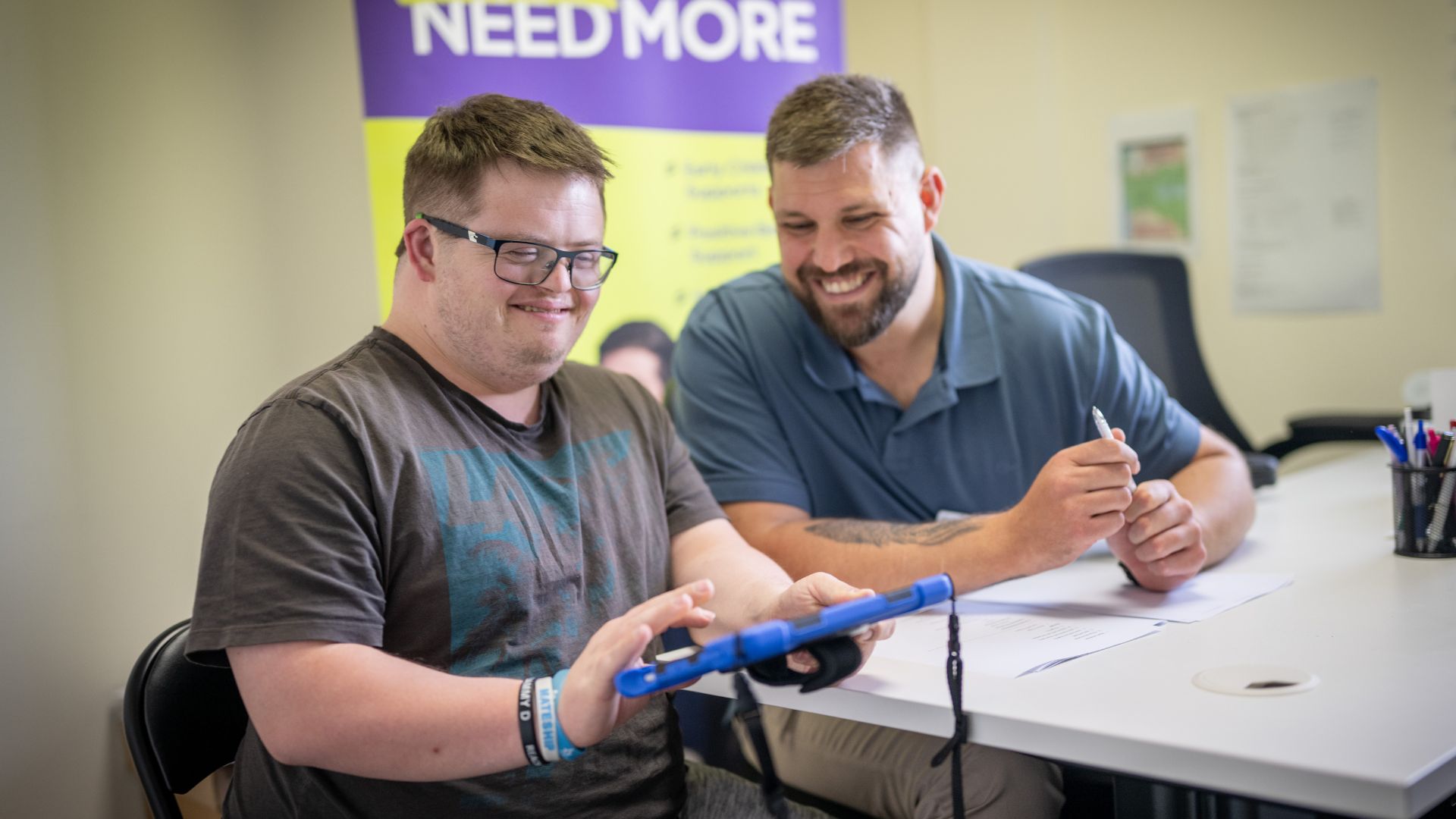 Jack and an Everyday Independence employment coach review ideas and goals during a planning meeting.