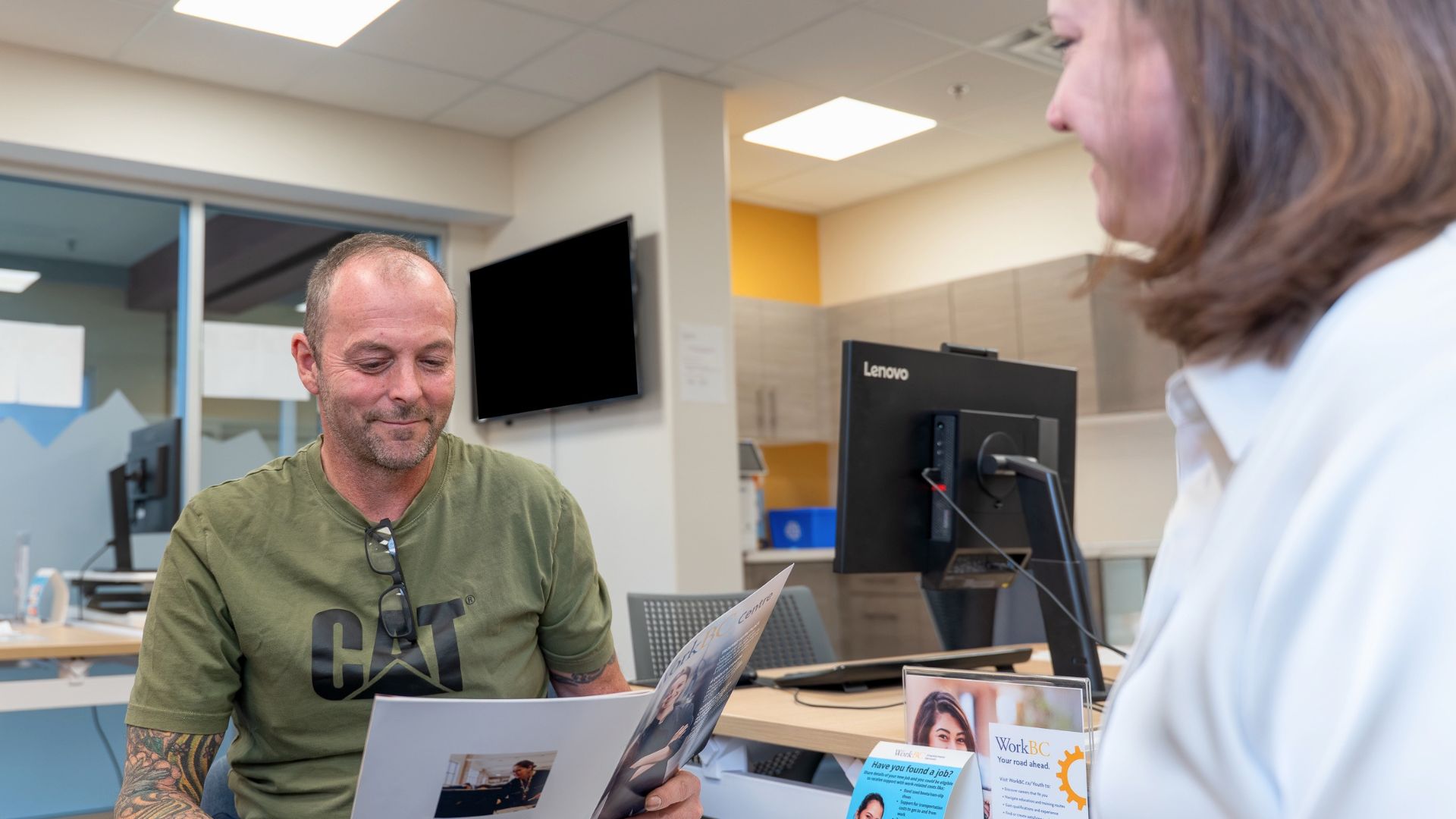 Silvio reviewing employment information with a WorkBC advisor while planning his next career move.