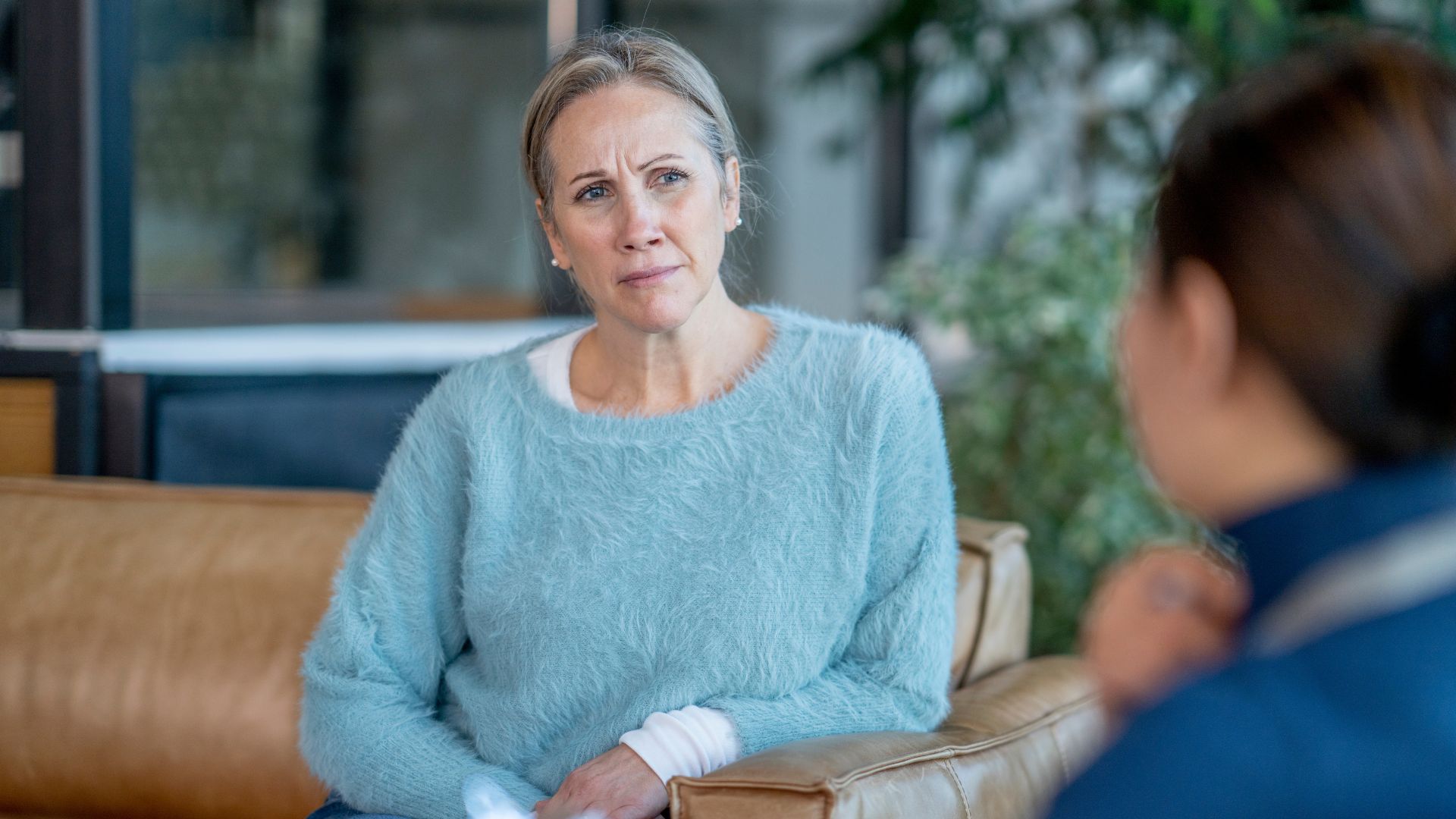 Individual in a counseling session, highlighting the importance of professional support for living with schizophrenia.