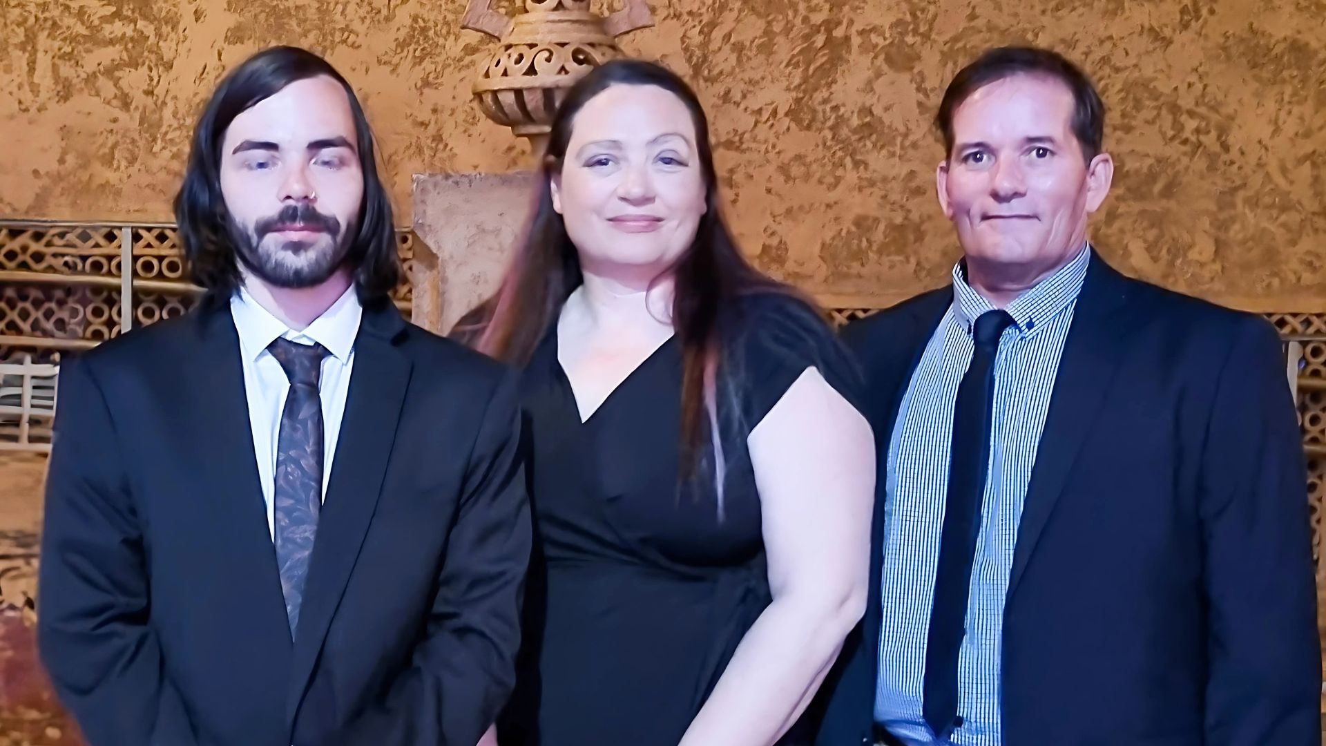 Joshua standing proudly with Barwon Prison supervisors Tanya and Brett at the Apprenticeship Training Awards ceremony, after gaining a job through Disability Employment Services