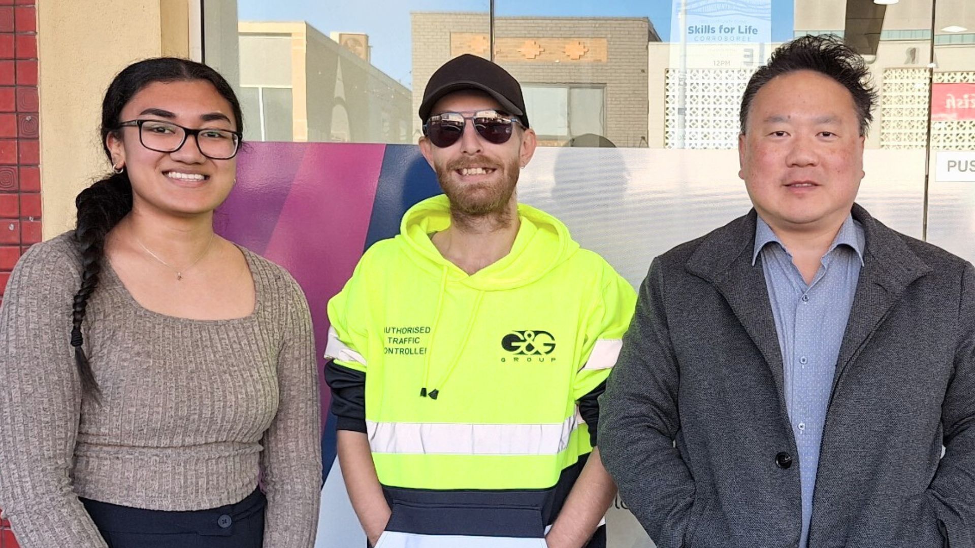 Philip a participant in Workforce Australia stands outside APM between his consultant and development manager