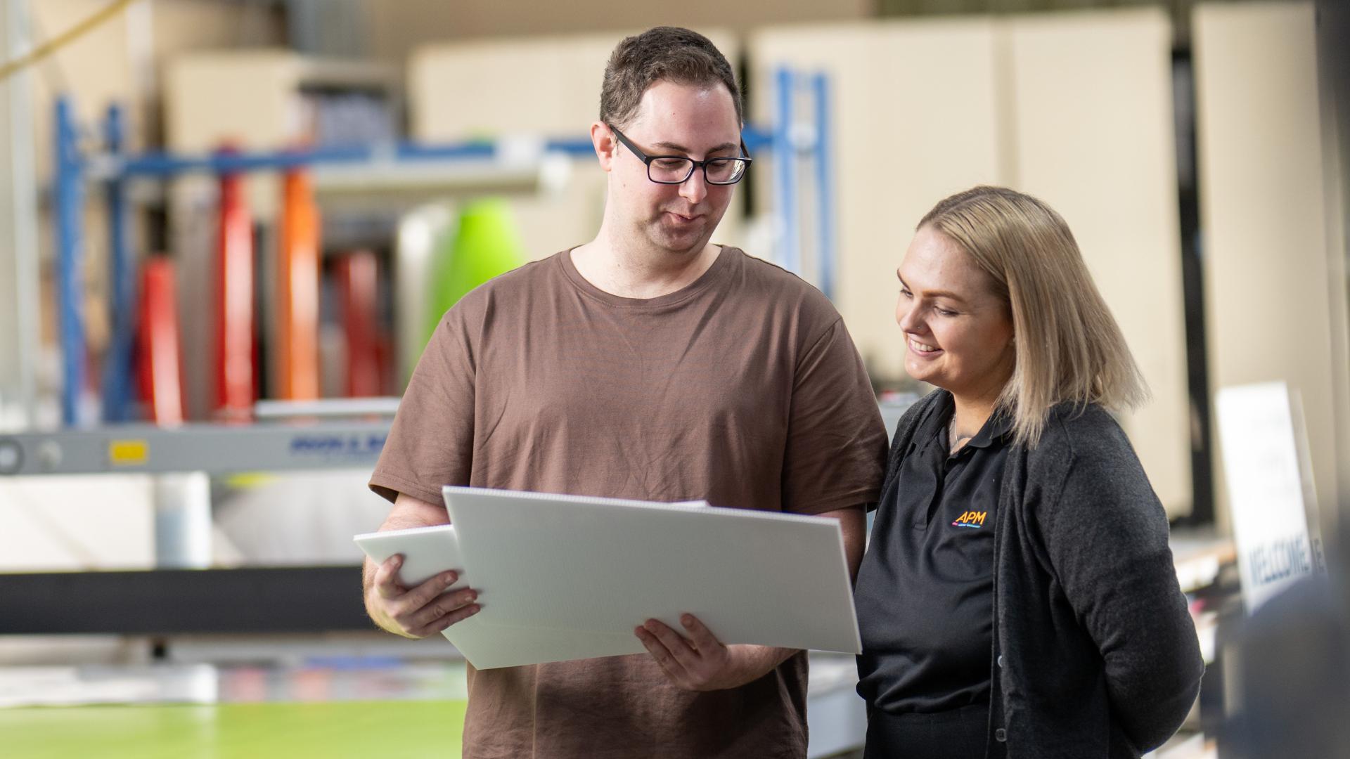 APM employment consultant speaking to a female business owner